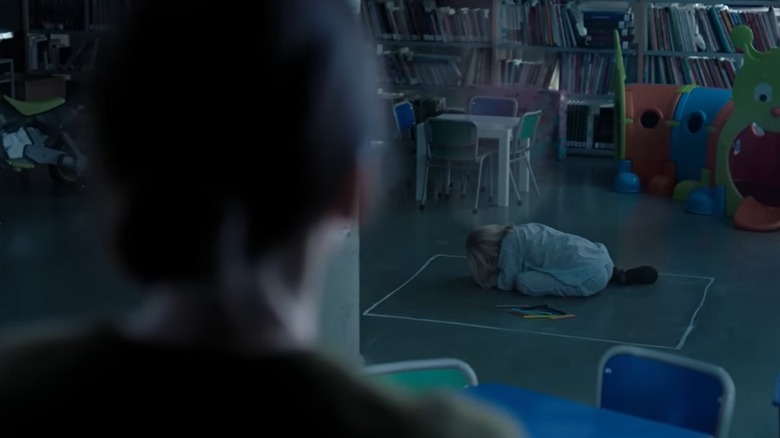 "The Chalk Line" woman looks at girl huddled in chalk box