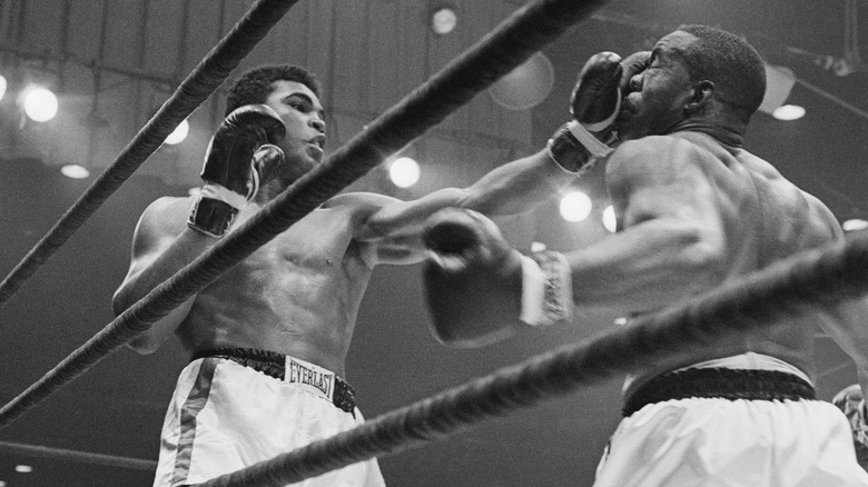 Cassius Clay punching Sonny Liston