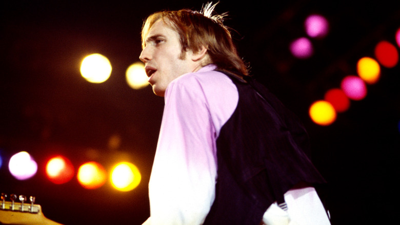 Tom Petty performing with lights in background