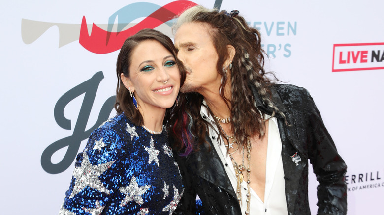 Steven Tyler kissing Aimee Preston