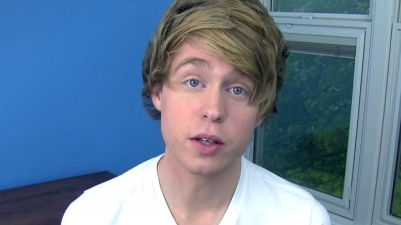 austin jones floppy hair white shirt