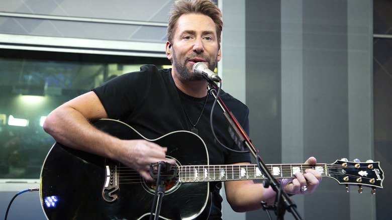 Chad Kroeger black shirt guitar singing