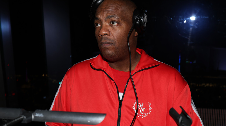 Mister Cee performing wearing headphones