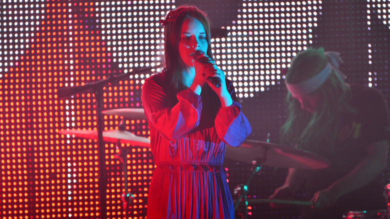 Nell Smith singing onstage with Flaming Lips