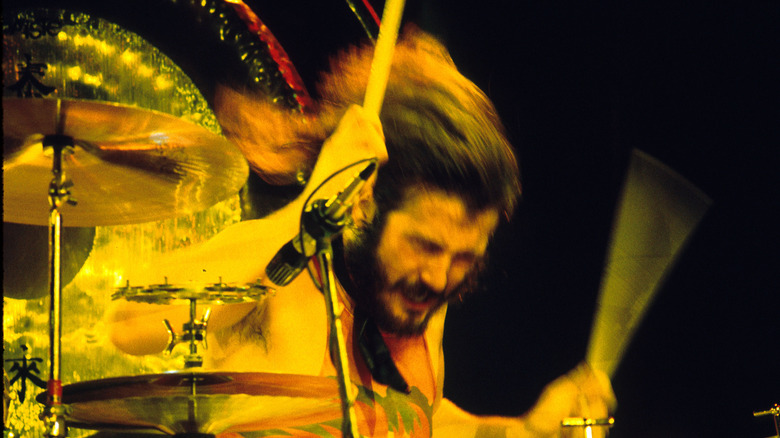 John Bonham with his eyes closed playing drums