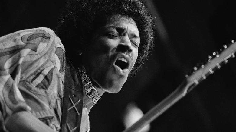 Jimi Hendrix performing on stage