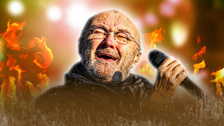 Phil Collins singing with fire around him