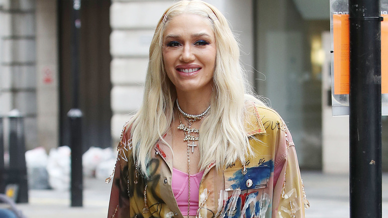 Gwen Stefani multicolored outfit London outside smiling