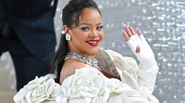 Rihanna white gown waving smiling