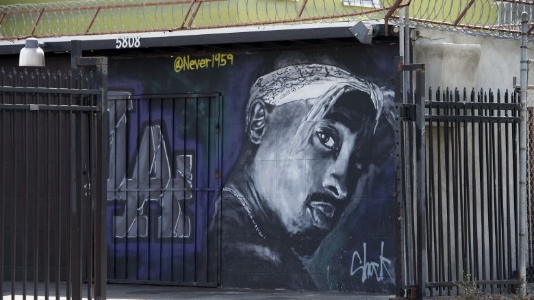 graffiti of tupac on wall