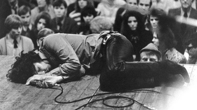 Jim Morrison lying on stage