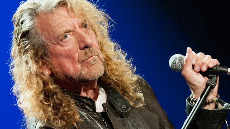 Robert Plant holding microphone