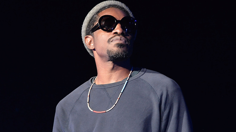 André 3000 in knit cap and sunglasses