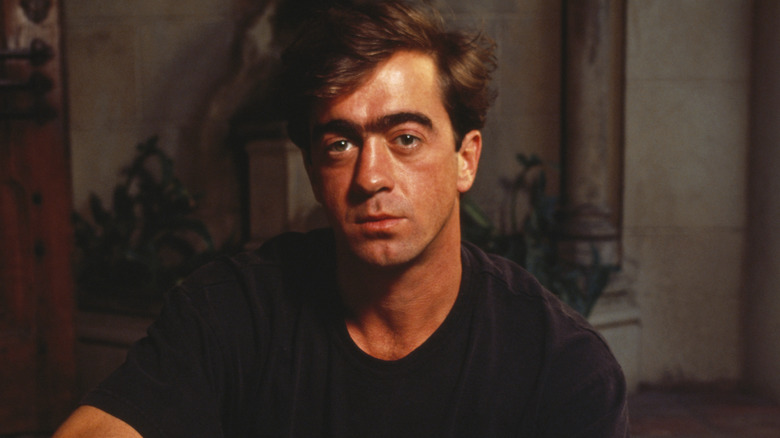 Bill Berry posing in a black t-shirt