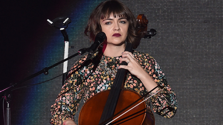 Neyla Pekarek playing cello at microphone