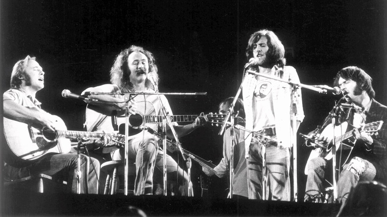 Crosby, Stills, Nash & Young performing on stage