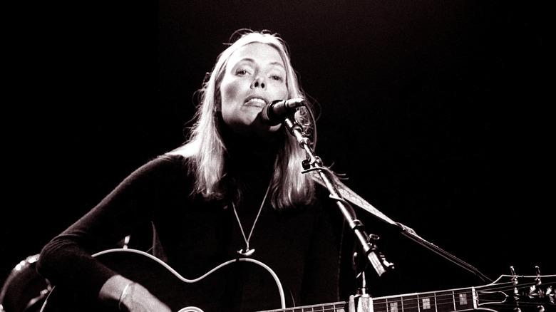 Joni Mitchell performing on stage