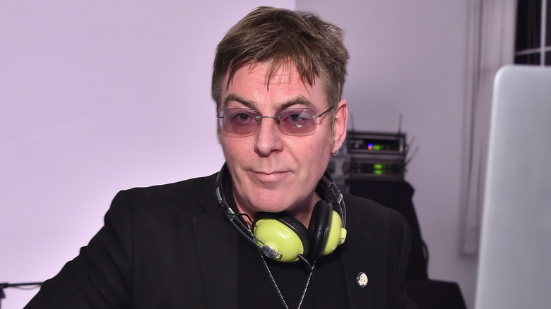 Andy Rourke tinted glasses green headphones