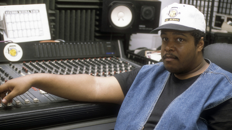 DJ Mark the 45 King seated in front of a mixing board