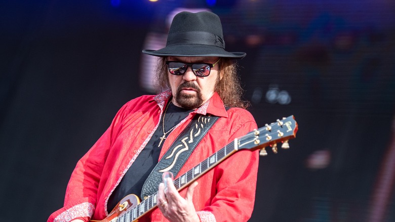 Gary Rossington playing guitar onstage