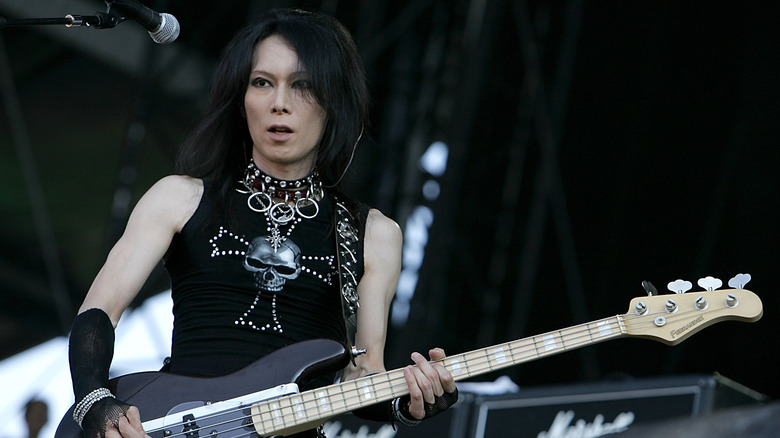 Heath of X Japan playing bass onstage