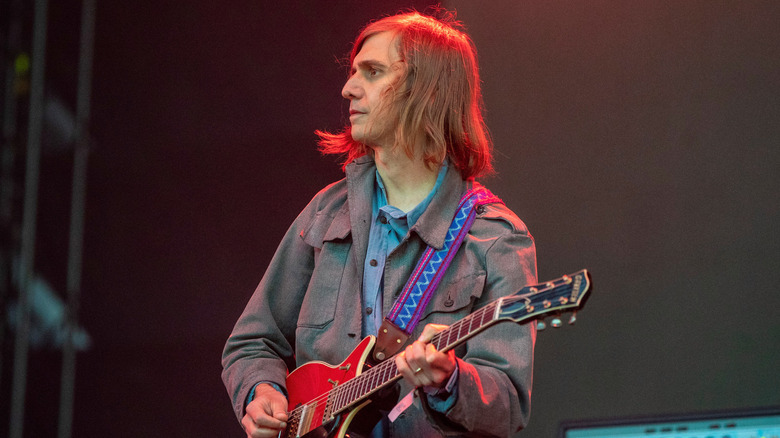 Rob Laakso playing guitar onstage