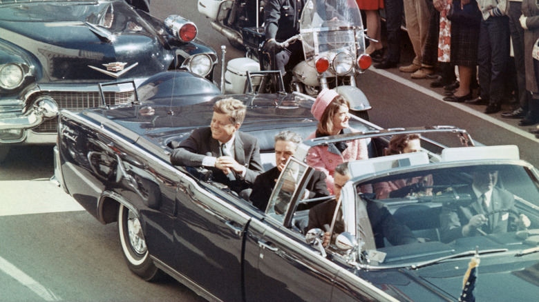 JFK in motorcade smiling