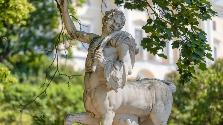 A statue of a centaur raising its arm