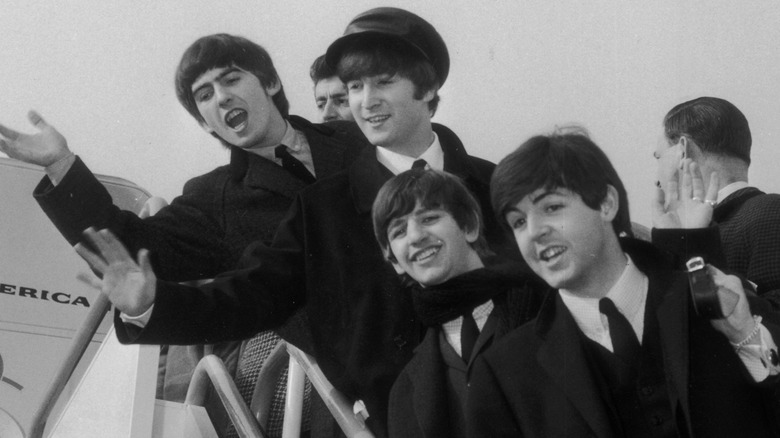 Beatles getting on airplane