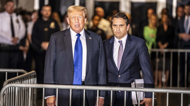 Donald Trump and lawyer posing