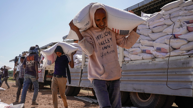 aid workers deliver food relief