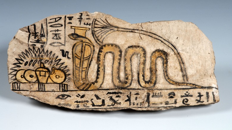 drawing of ancient egyptian snake on pottery shard