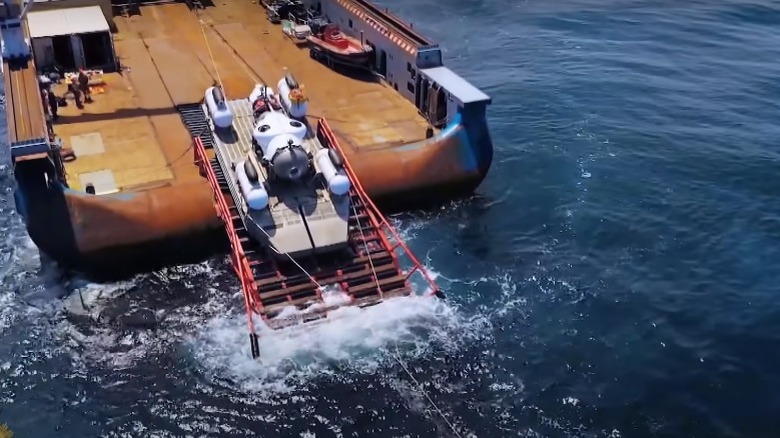 The Titan submersible entering the sea aboard its launching platform