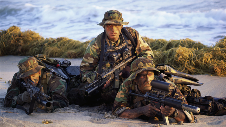 navy seals uniform guns on beach