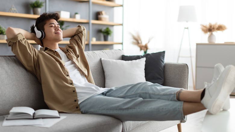 guy sitting on the couch doing nothing