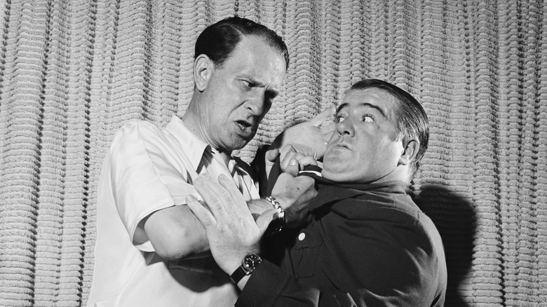 Bud Abbott and Lou Costello play-fighting