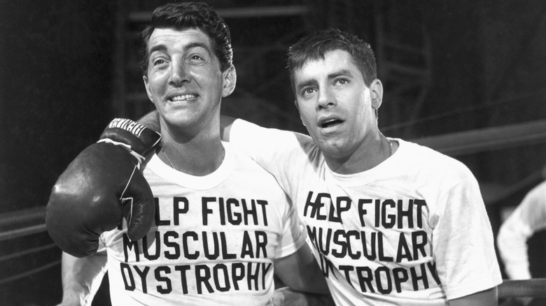 Jerry Lewis and Dean Martin wearing boxing gloves