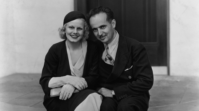 Jean Harlow and Paul Bern sitting on a stoop