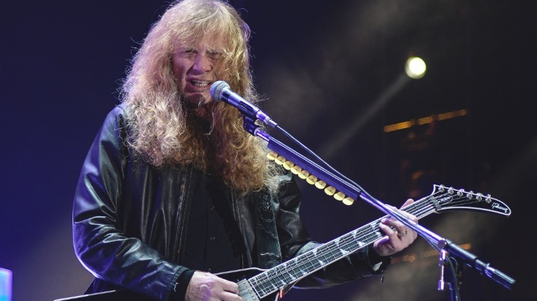 Mustaine long hair performing onstage