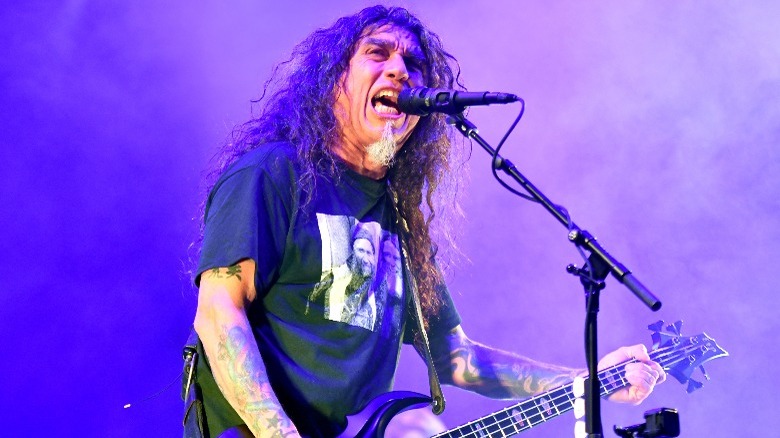 Tom Araya long hair on stage performing