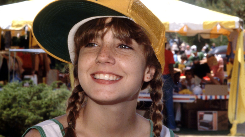 Dana Plato wearing a baseball cap