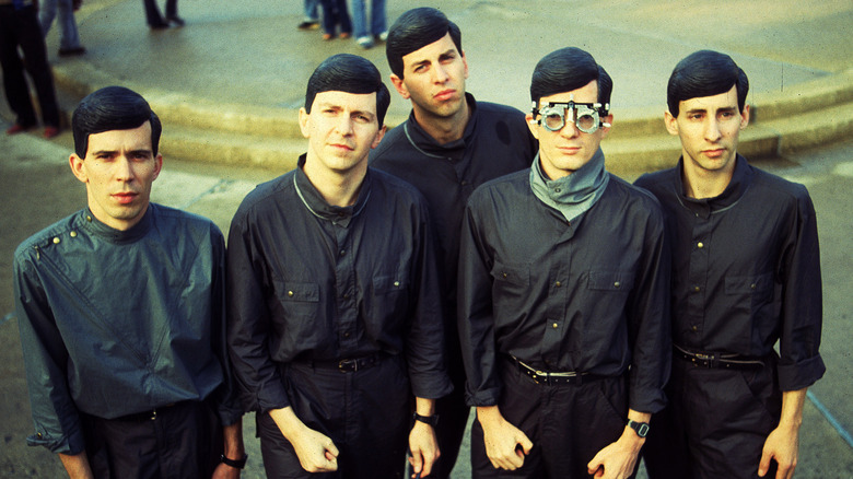 Devo in the 1980's all dressed in black button-up shirts