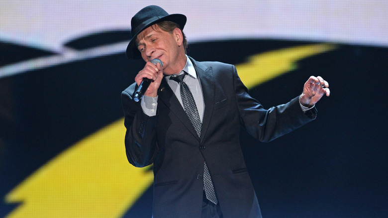 Bobby Caldwell hat suit performing onstage