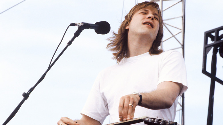 Jeff Healey white T-shirt playing guitar onstage