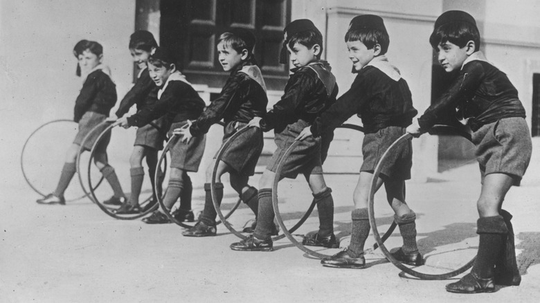 Balila boys playing with hoops