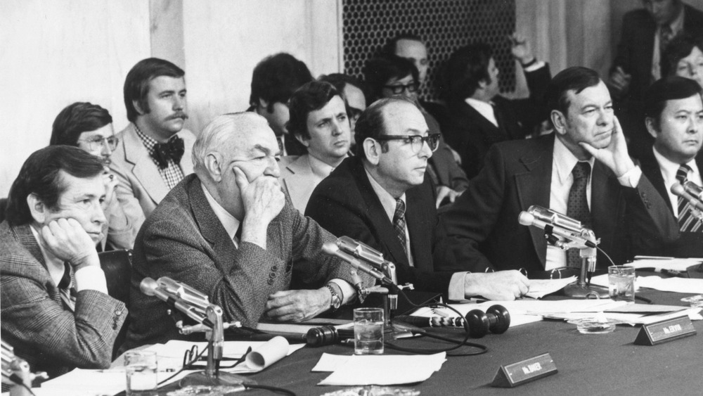 Senator Howard Baker of Tennesse, Senator Sam Irvin of North Carolina, Majority Council Sam Dash, Senator Herman E Talmadge of Georgia and Senator Daniel Inouye of Hawaii listening to the testimony of James McCord, one of the Watergate burglers, during the Watergate hearings. 