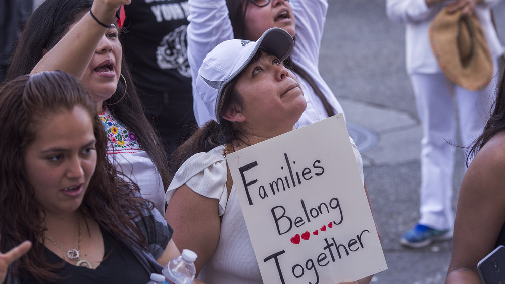 Anti-ICE demonstrator holding sign