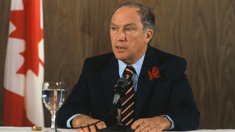 Pierre Elliott Trudeau speaking into microphone