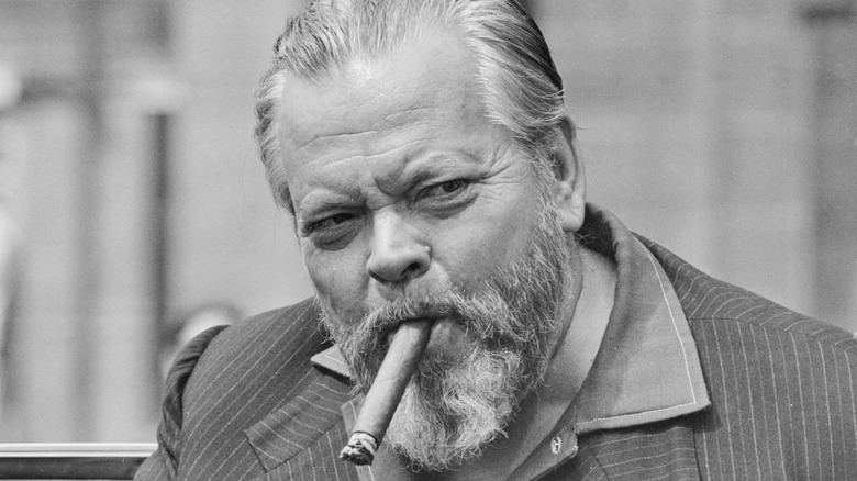 Orson Wells enjoys a cigar