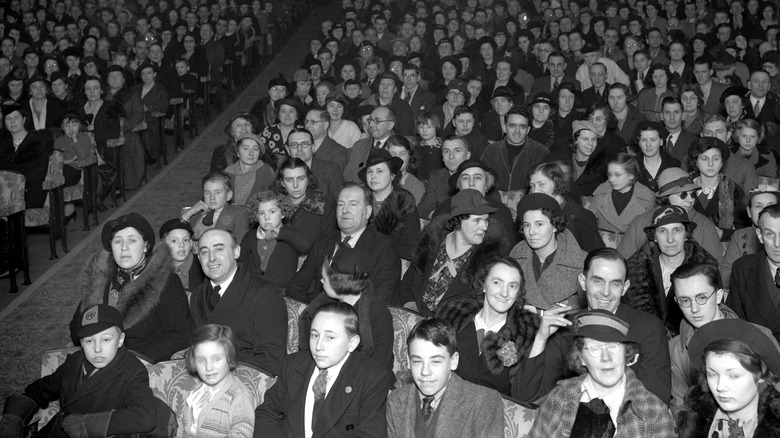 People in audience at movie theater